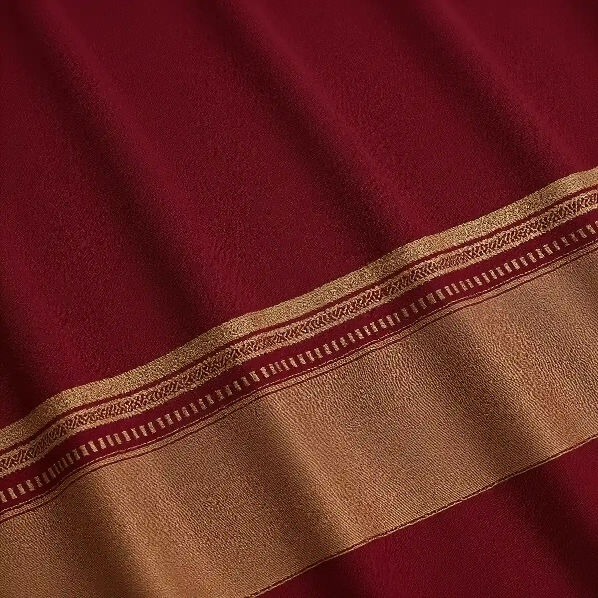 Close-up-detailed-view-of-striped-maroon-saree-fabric-showing-the-texture-stripes-pattern-and-border-details-with-golden-beige-accents.webp